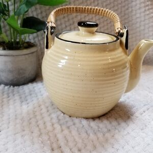 Little ceramic and rattan tan and black tea kettle